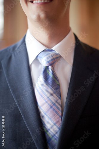 Groom in a Tux with a Pink and Blue Tie