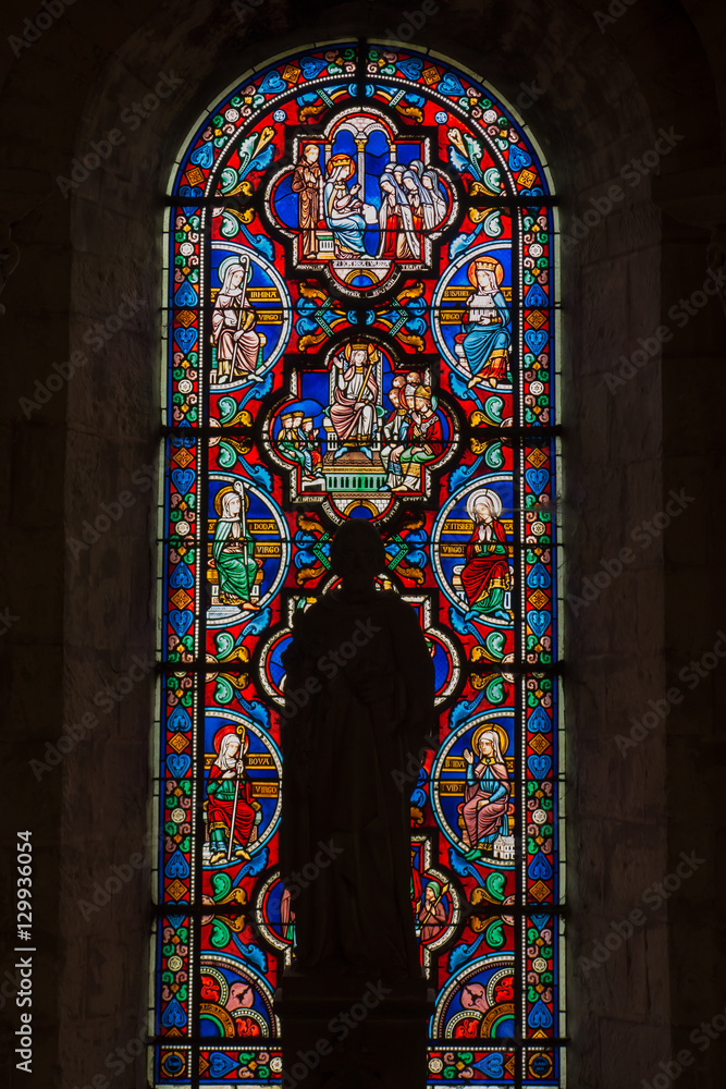 Poitiers, France - September 12, 2016: Colorful stained glass wi - obrazy, fototapety, plakaty 