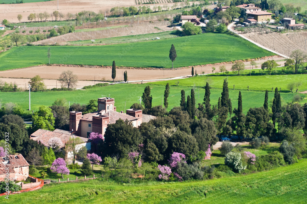 Old farmhouse in the green countryside in the province of Arezzo in Tuscany