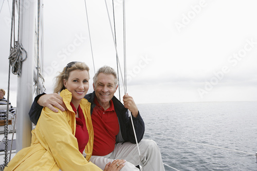 Portrait of a happy Caucasian couple on sailboat © moodboard