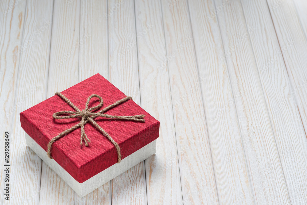 Gift box on a white wooden background. Gift box on a white wooden background.