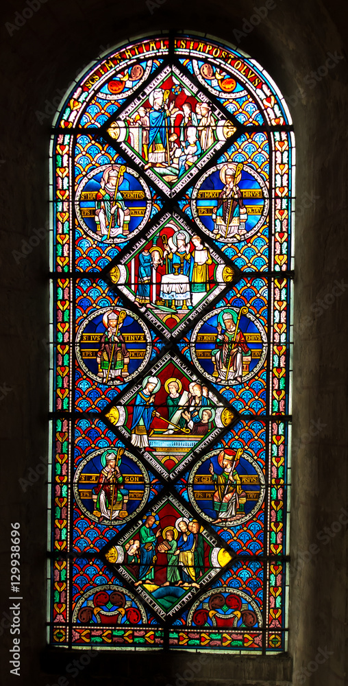 Poitiers, France - September 12, 2016: Colorful stained glass wi - obrazy, fototapety, plakaty 