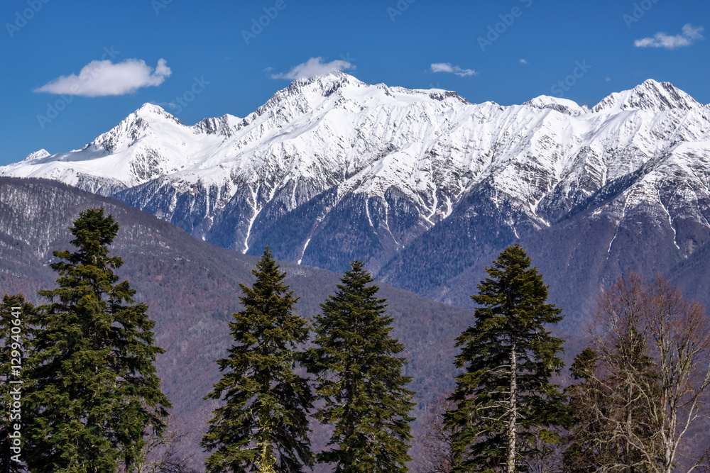 Beautiful mountain scenery of the Main Caucasian ridge with snowy peaks at winter