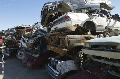 Stack of damaged cars in a junkyard