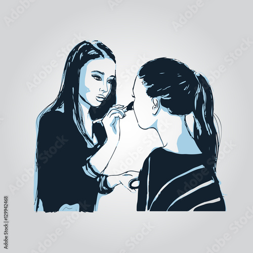Woman makeup makeup artist paints on the face of his client.