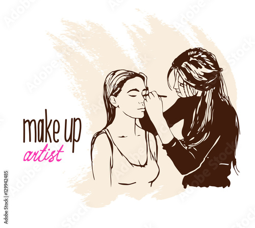 Woman makeup makeup artist paints on the face of his client. 