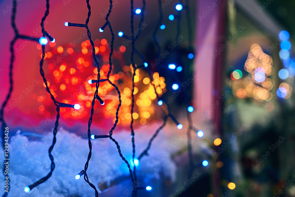 LED electric Christmas lights making beautiful magical colors and bokeh