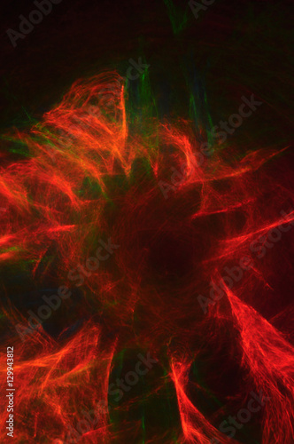 Abstract composition of dark colored smoke in the dark, red, blu