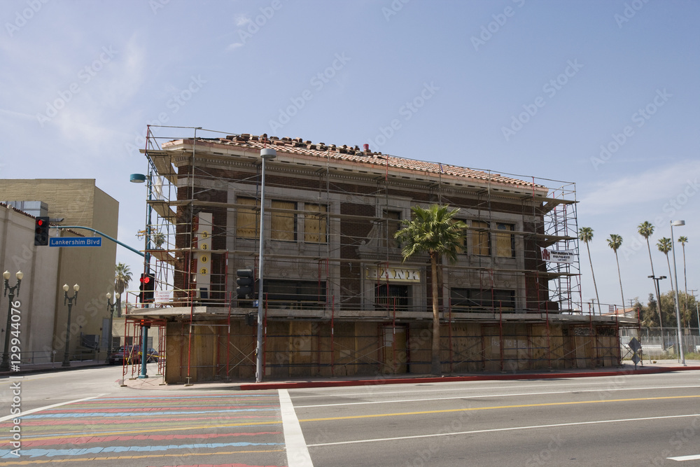 Building abandoned due to foreclosure with road in the foreground Building abandoned due to foreclosure with road in the foreground