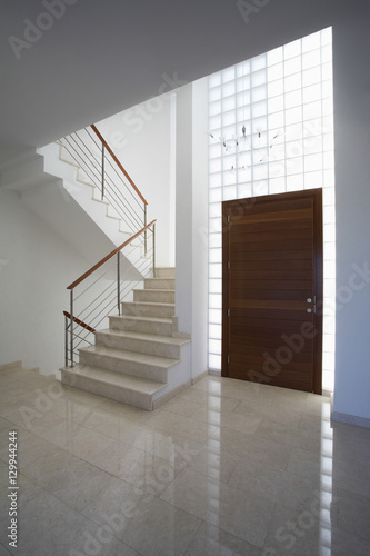 Interior of town house with staircase and door