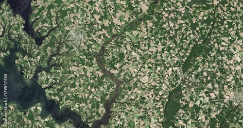 High-altitude overflight aerial of farmland near Maryland's Choptank River. Clip loops and is reversible. Elements of this image furnished by USGS/NASA Landsat  photo