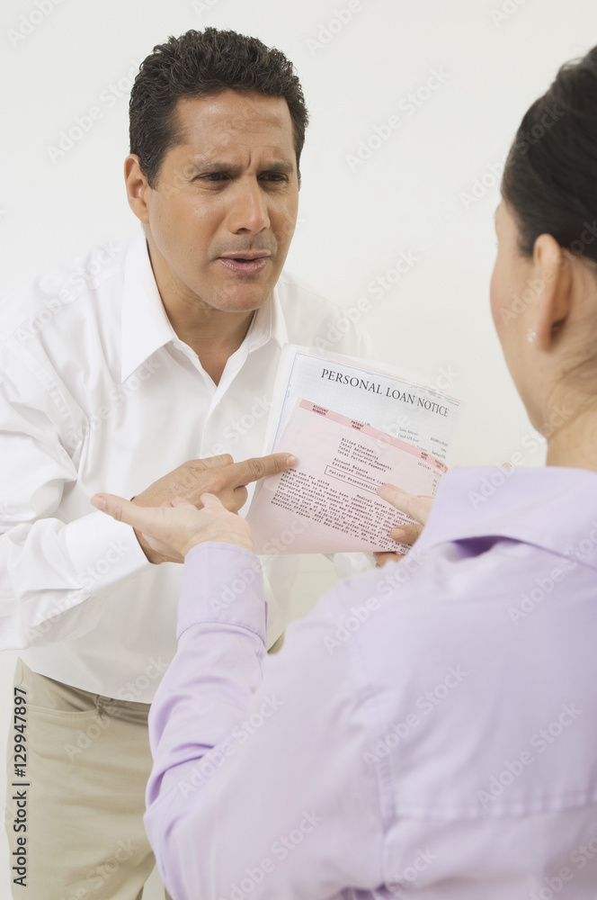 Couple over documents isolated over white background Couple over documents isolated over white background