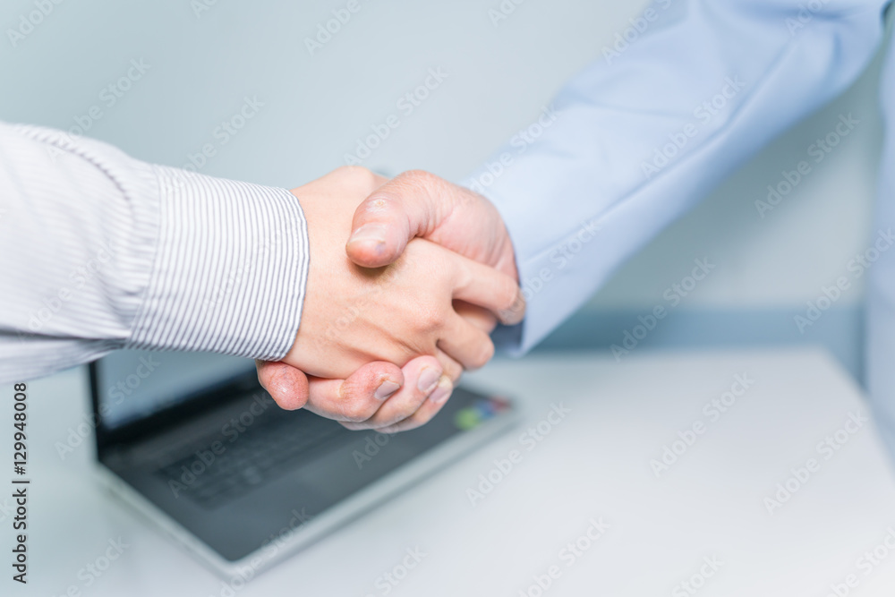 Fototapeta premium Business partnership concept ; Image businessmans handshake. Successful handshaking after good deal. closing the deal after singing the lucrative contract between companies.