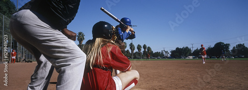 Photography Professional female baseball team practicing on ground with umpire