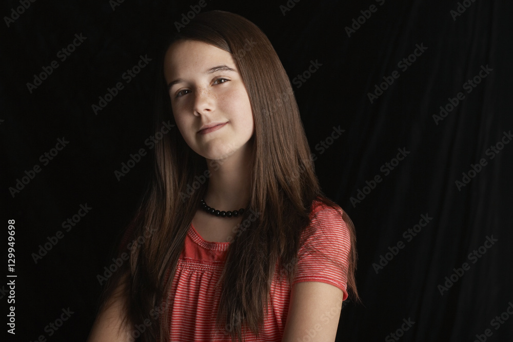 Closeup portrait of beautiful teenage girl isolated on black background Closeup portrait of beautiful teenage girl isolated on black background