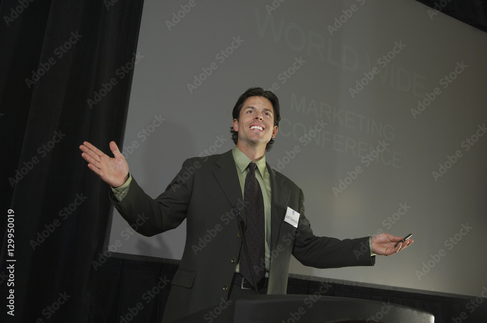 Businessman giving a lecture at conference Businessman giving a lecture at conference