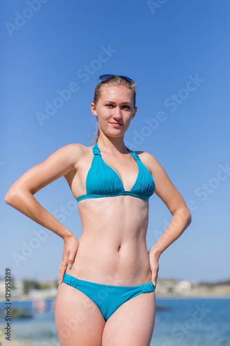 Portrait of girl in blue bikini at the sea
