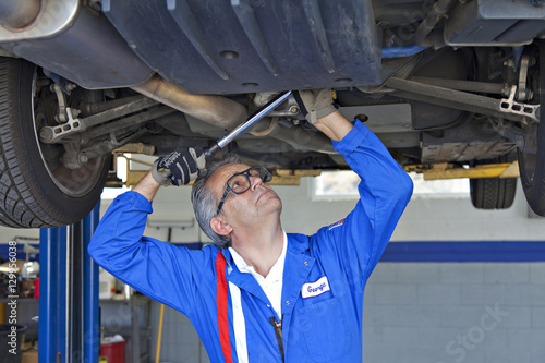 Photography Mechanic repairing the car with a monkey wrench