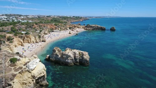 Aerial. Beautiful beach Sao Rafael with tourists on the shores of Albufeira.