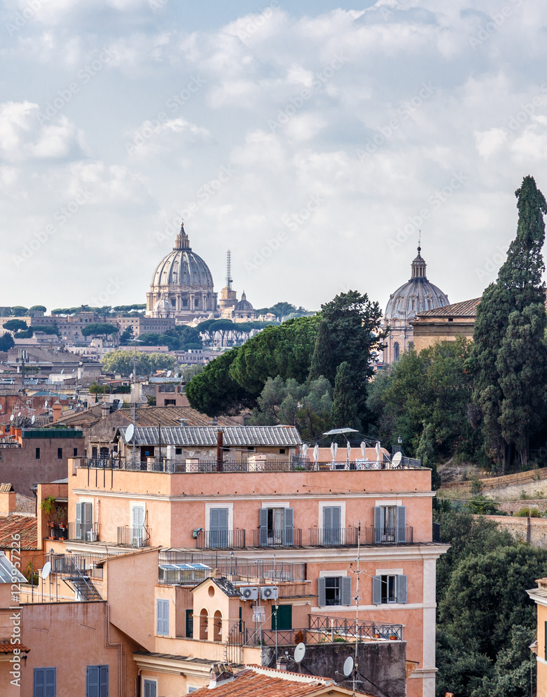 Roofs of Rome and the dome of St. Peter's Basilica