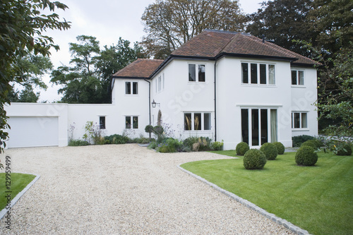 Photos House exterior with surrounding yard and driveway