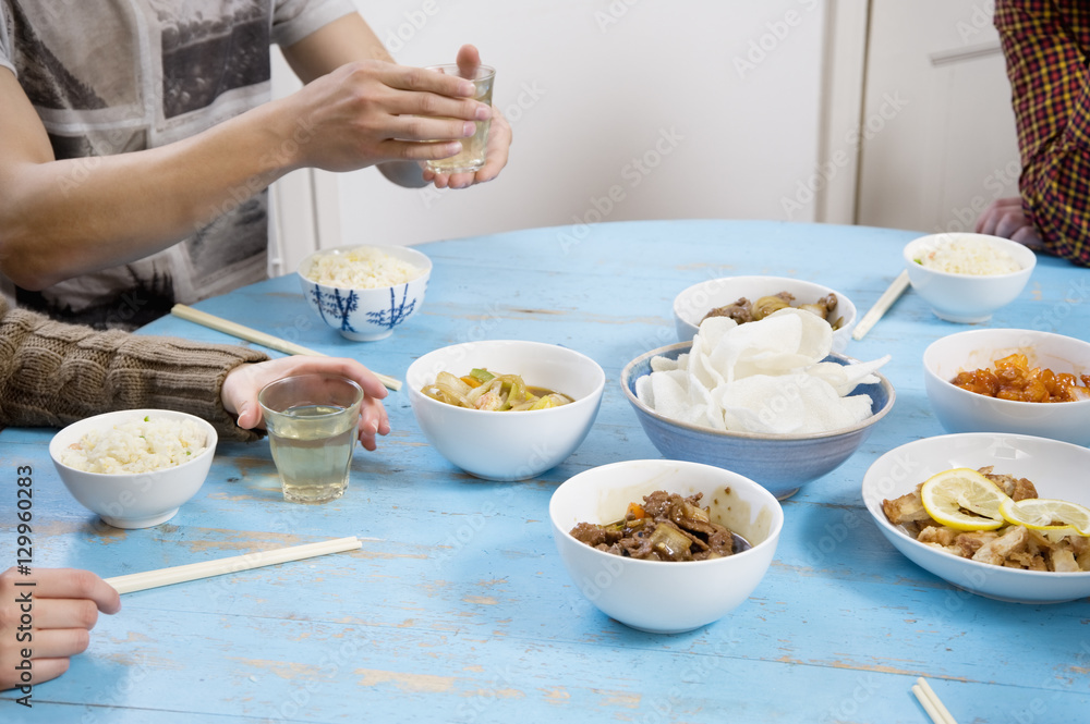 People having breakfast on table together People having breakfast on table together