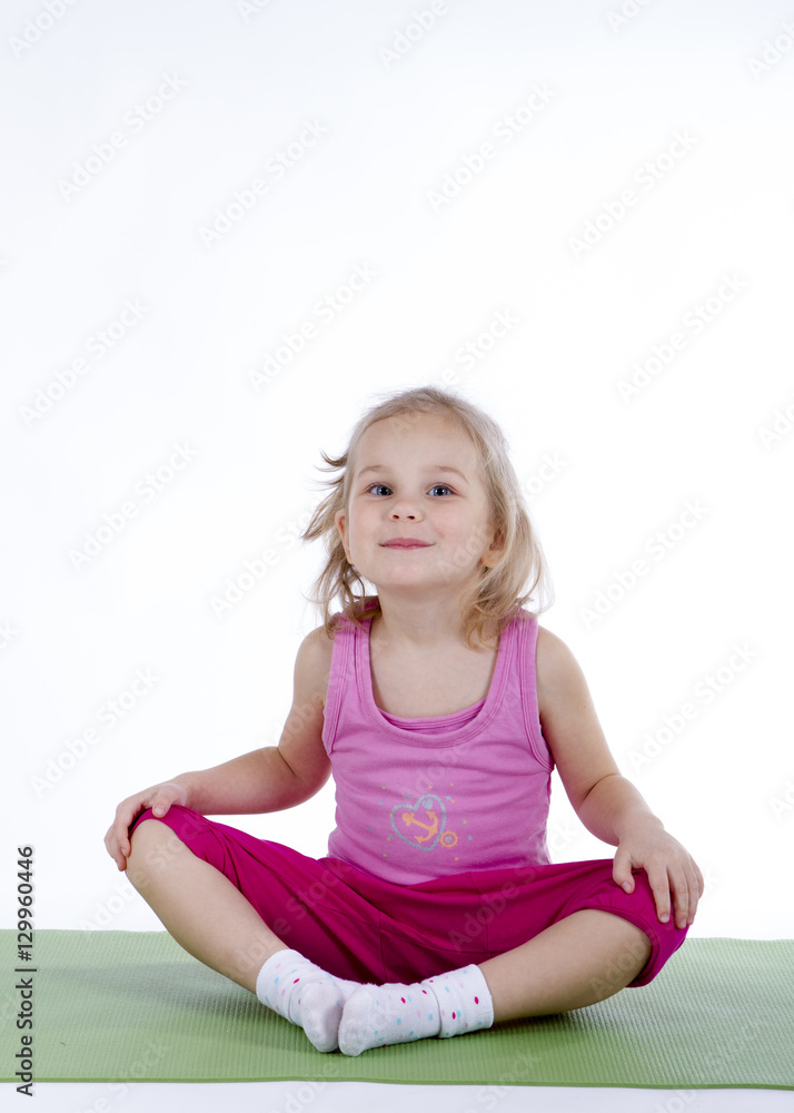 little girl doing gymnastic exercises on the mat little girl doing gymnastic exercises on the mat