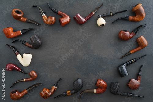 Valokuva Collection of pipes with copyspace in the middle