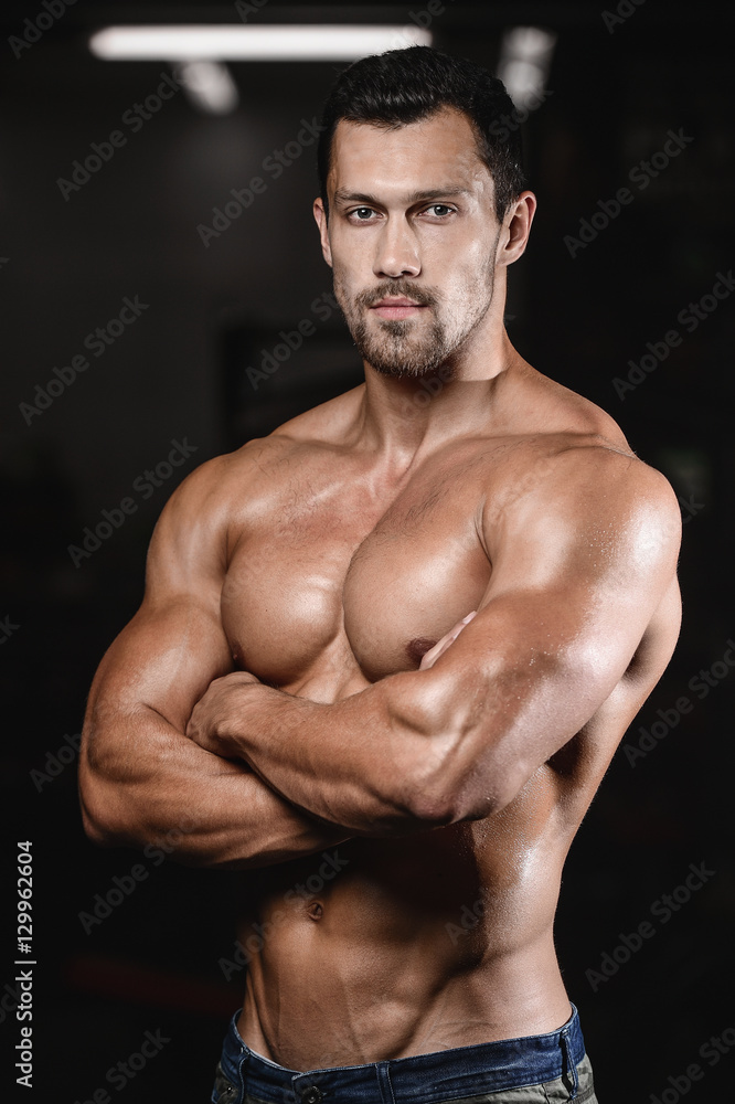 man with weight training in gym equipment sport club man with weight training in gym equipment sport club