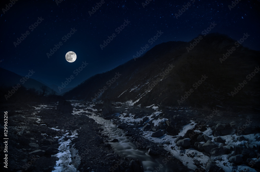 full moon over mountain and river snowy landscape in Azerbaijan winter night full moon over mountain and river snowy landscape in Azerbaijan winter night
