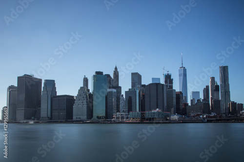 New York financial district with skyscrapers over East River © ozphotoguy