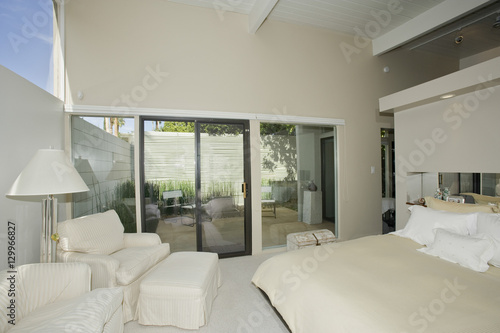 Luxury bedroom with view of porch in modern home © moodboard