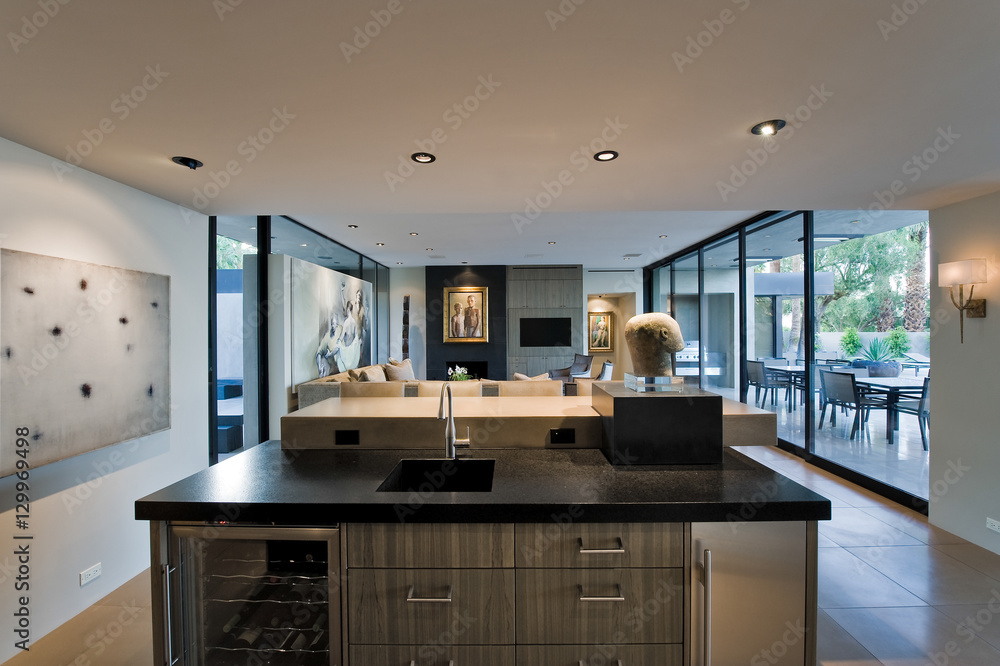 Modern kitchen with view of living room and porch in the background at home