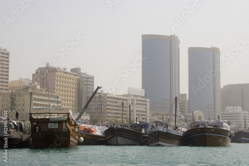 Dubai UAE Dhows old wooden sailing vessels are docked along the Deira side of Dubai Creek.