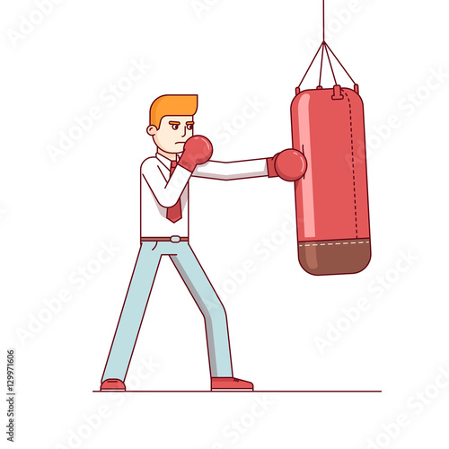 Standing business man hitting punching bag hard