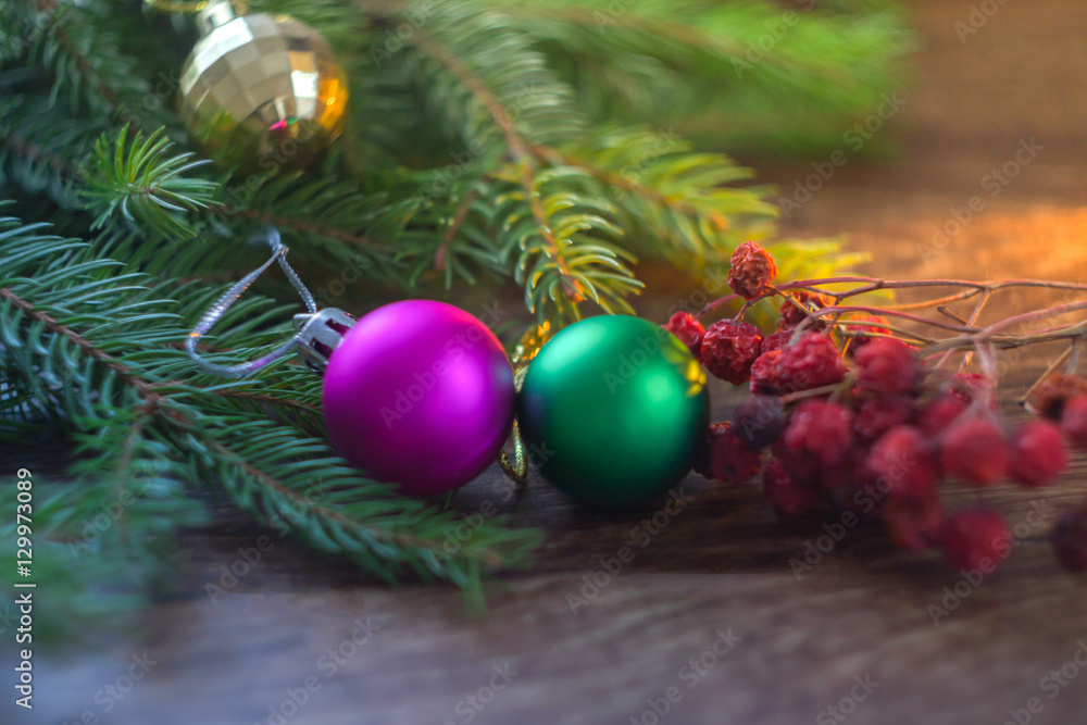 Christmas decorations tree branch on a wooden background