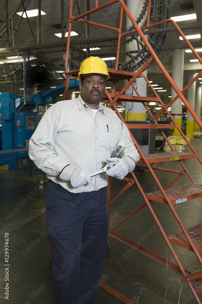 Portrait of a serious man working in newspaper factory Portrait of a serious man working in newspaper factory