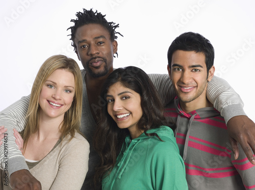 Portrait of multiethnic young people against white background