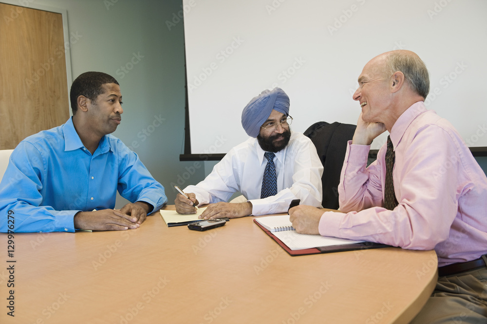 Multiethnic group of businesspeople in a meeting at office