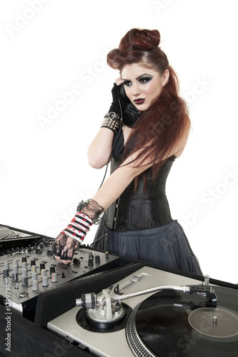 Beautiful DJ with sound mixing equipment over white background