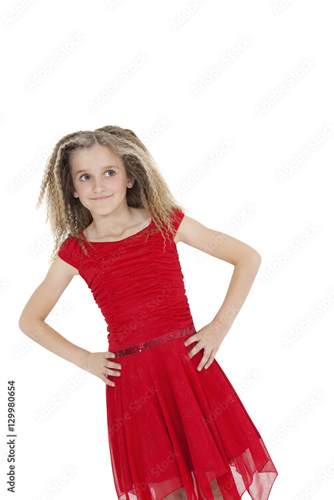 Tilt image of girl in red frock with hands on hips over white background