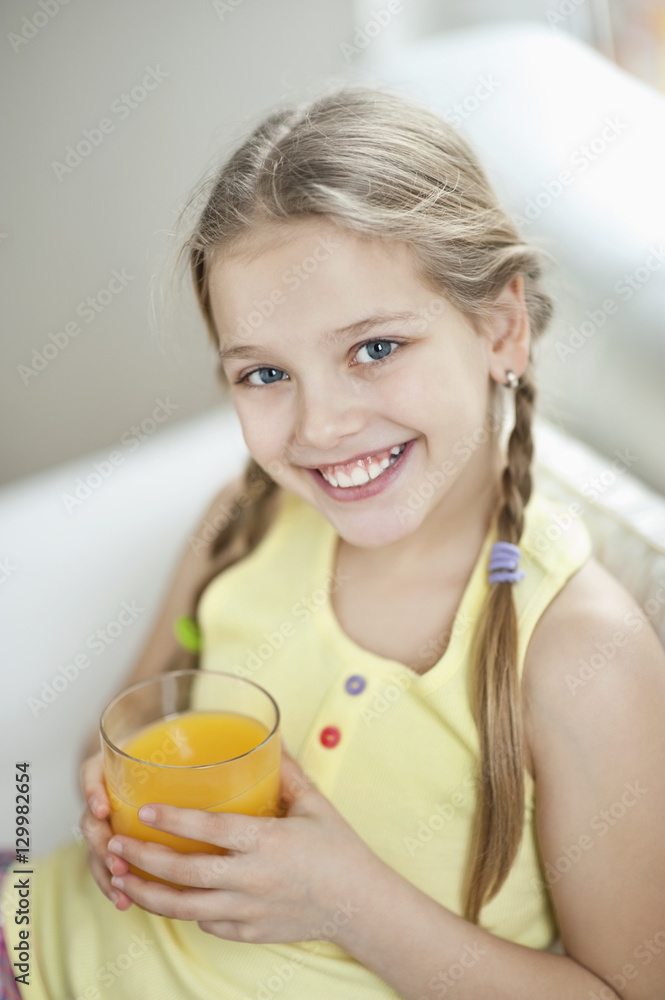 Portrait of girl drinking orange juice Portrait of girl drinking orange juice