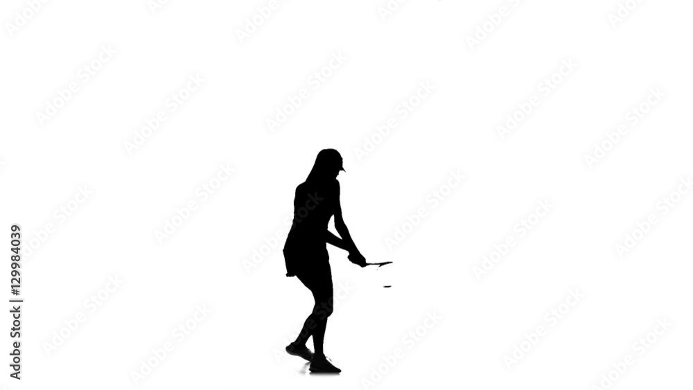 Girl plays tennis and discourage racket ball. Slow motion. Silhouette Girl plays tennis and discourage racket ball. Slow motion. Silhouette