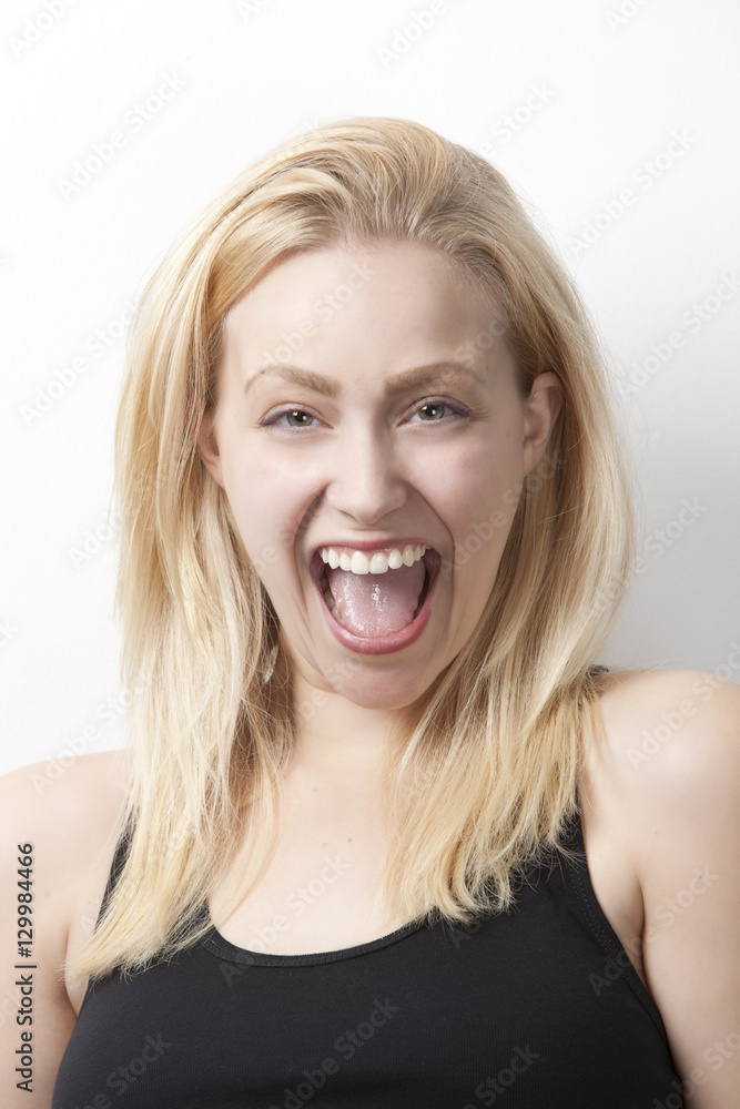 Portrait of cheerful young Caucasian woman against white background Portrait of cheerful young Caucasian woman against white background