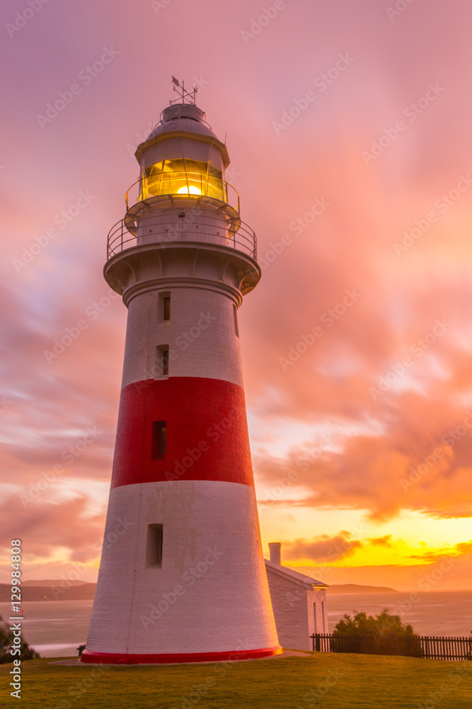 Low Head Lighthouse in Georgetown, Tasmania, Australia illuminated at sunset