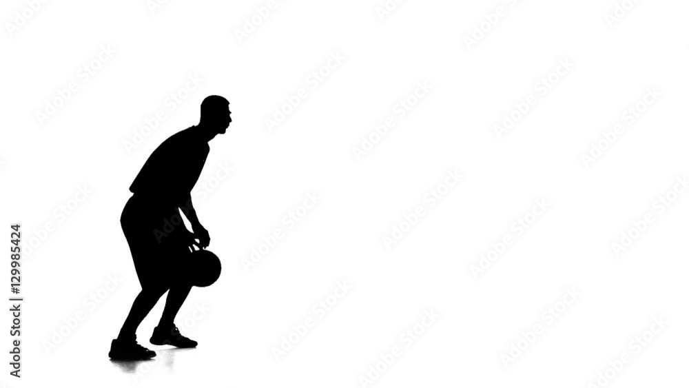 Basketball player fills the ball throws it forward. Side view Basketball player fills the ball throws it forward. Side view