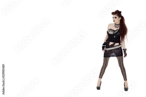 Portrait of beautiful young punk woman posing over white background
