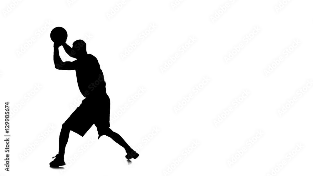 Basketball player holding the ball and makes a feint. Silhouette Basketball player holding the ball and makes a feint. Silhouette