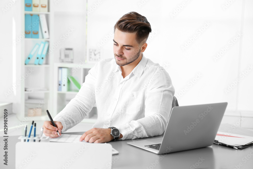 Handsome man working in office Handsome man working in office