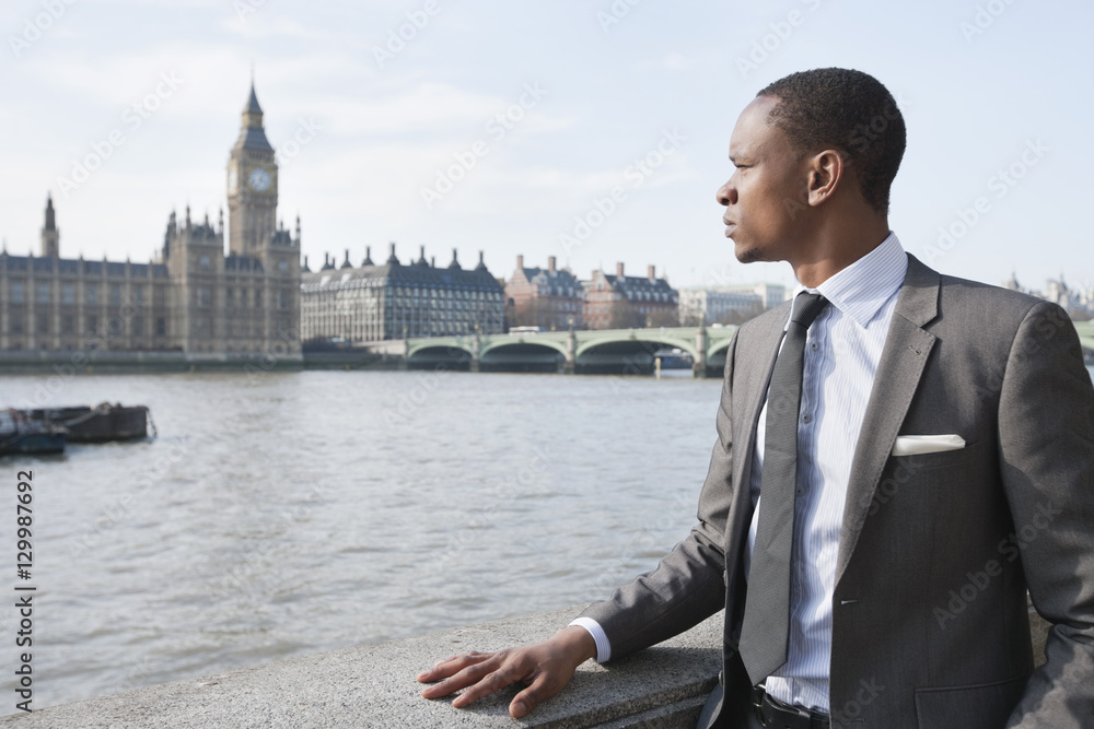 African American businessman looking at buildings African American businessman looking at buildings